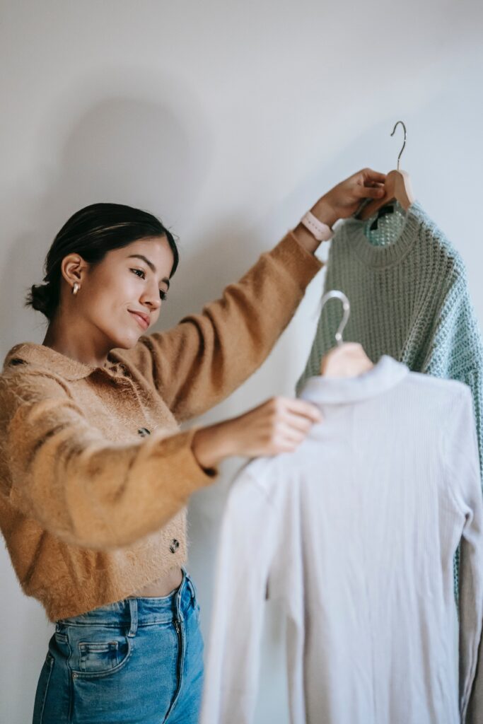 Albuquerque image consultant and color analysis woman holding sweater options