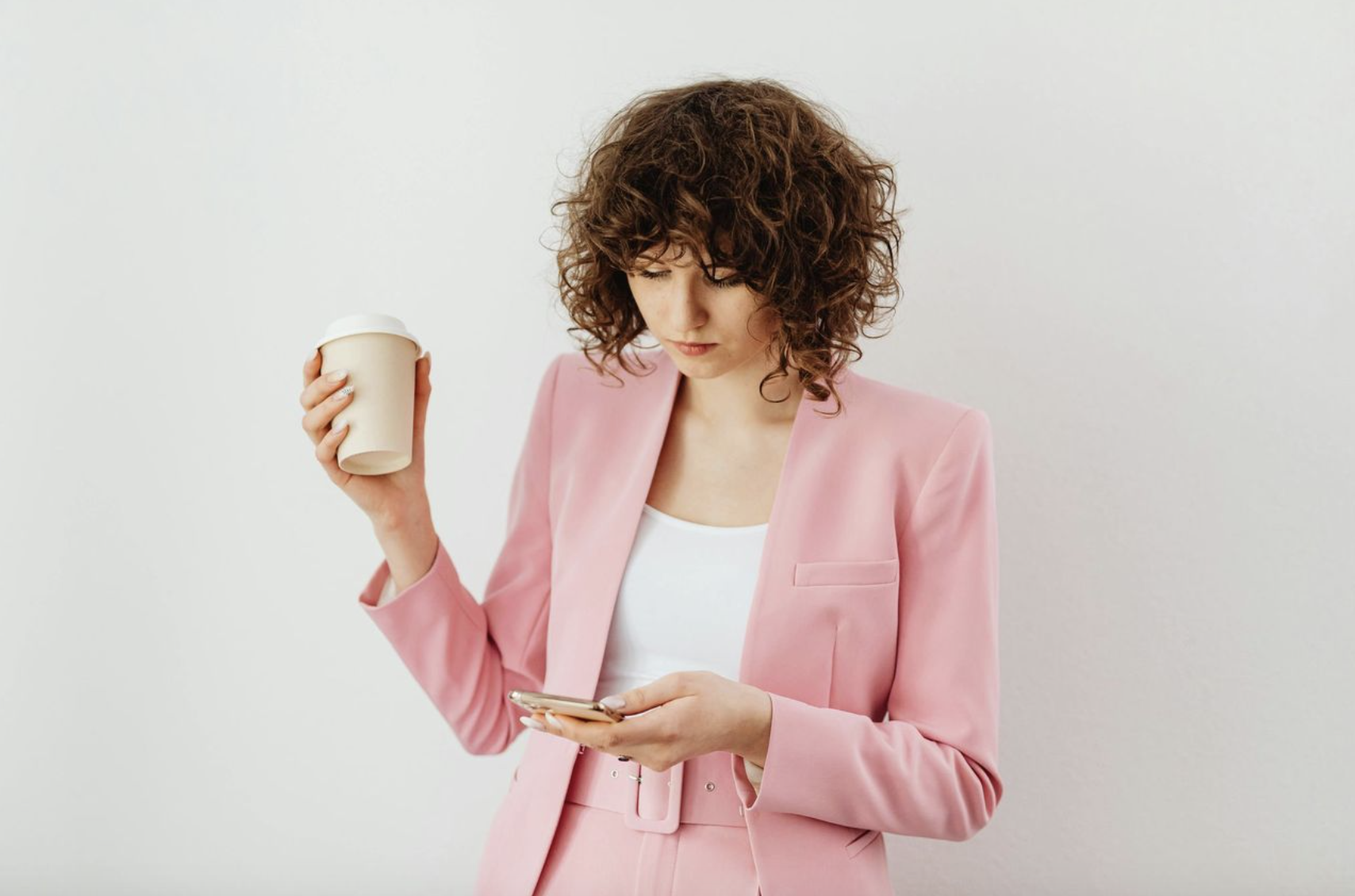 Young Professional's Style and Tips women wearing pink blazer and working