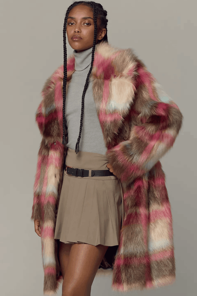 Model wearing colorful plaid faux fur jacket. 