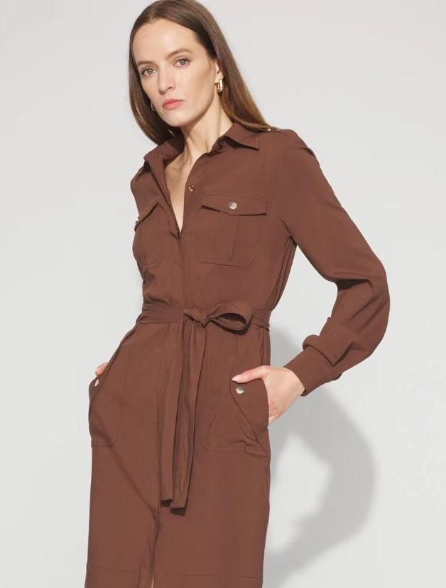 A woman wearing a chocolate brown long sleeve utility shirt.