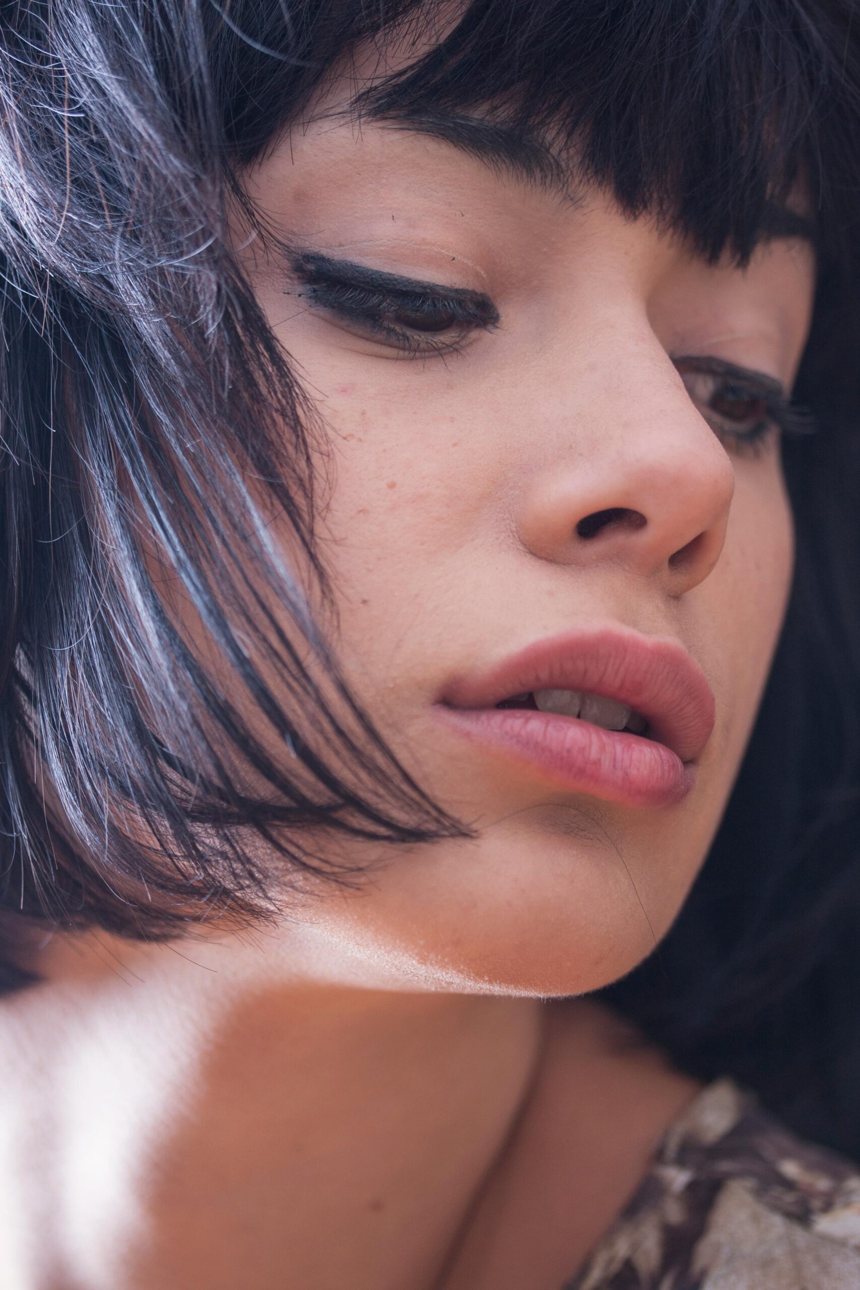 Close-up of a model’s face with minimal makeup.