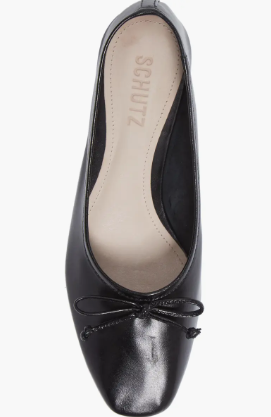 Black ballet flats with a minimal ribbon detail.