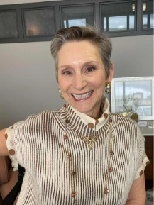 Monica smiling after her makeup session at The Honest Image in Albuquerque