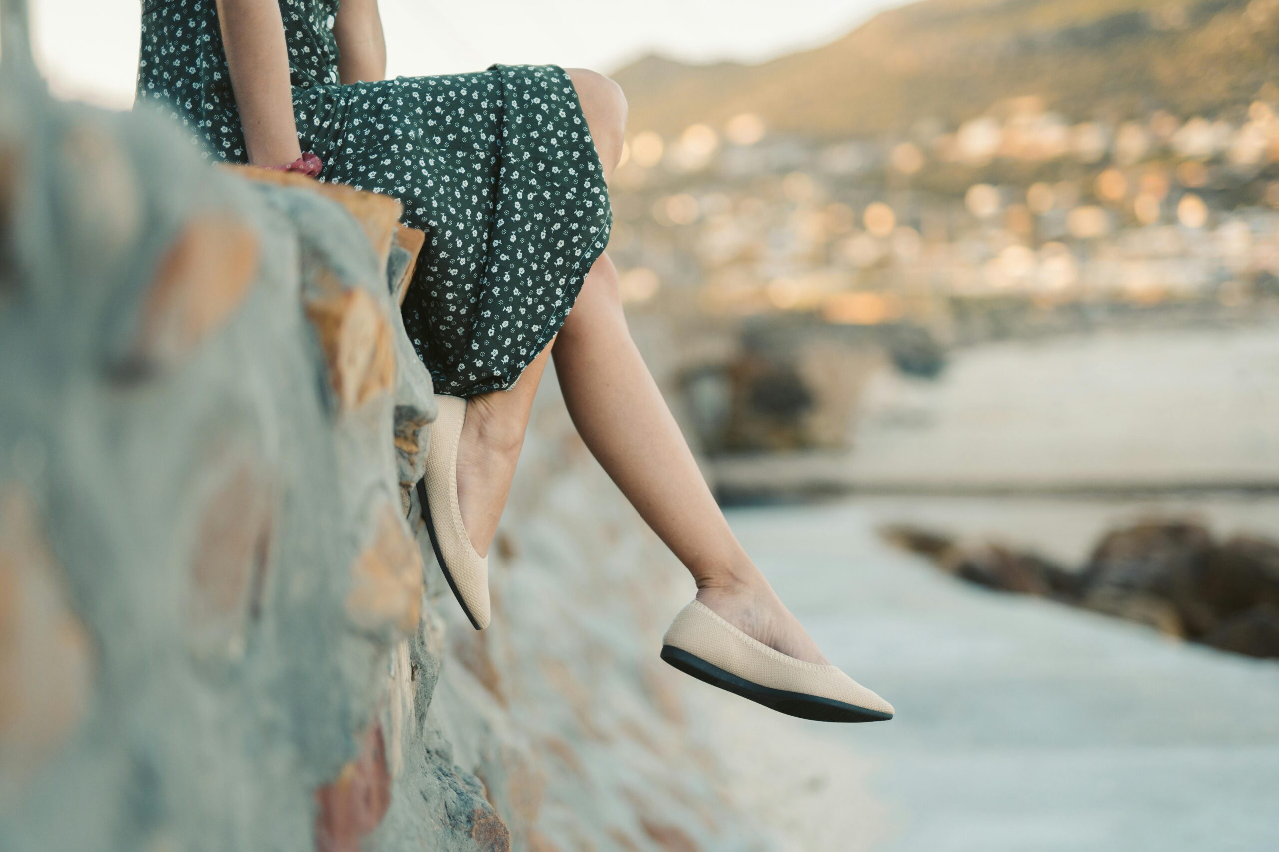 A woman’s feet wearing sandals on a summer day.