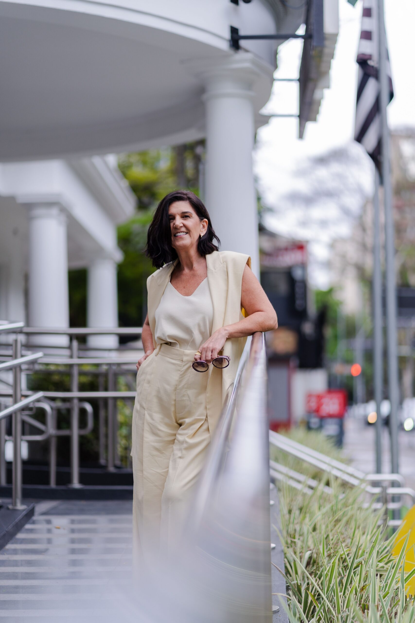 Smiling woman wearing an elevated summer outfit with effortless, polished style.